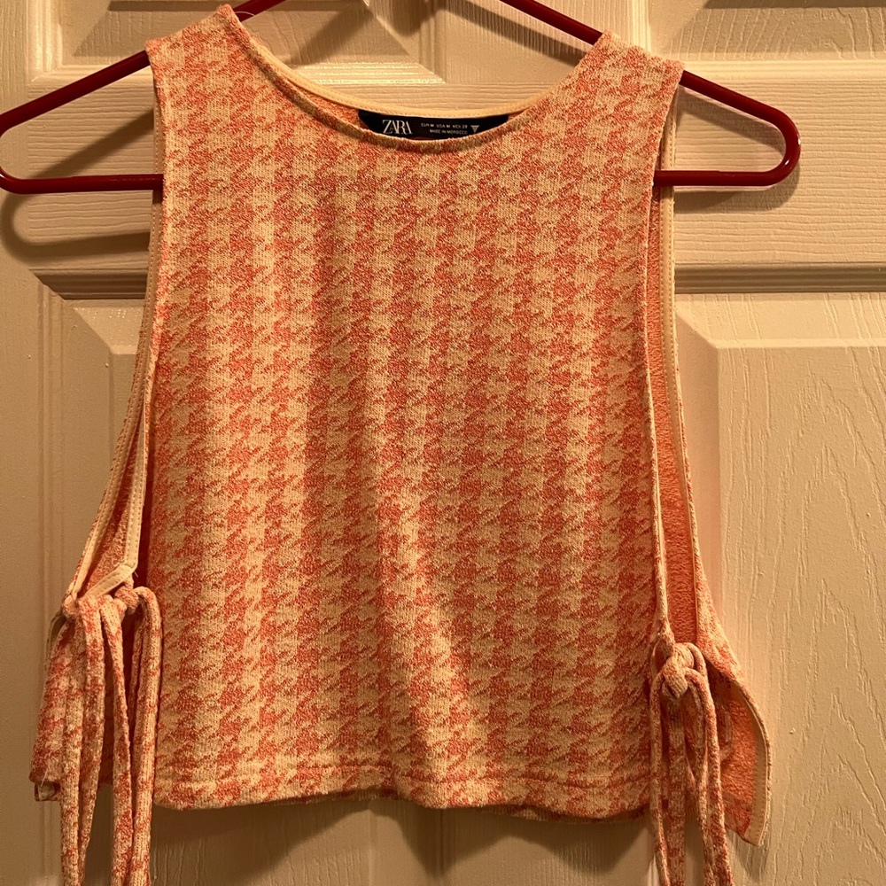 Sleeveless crop top.